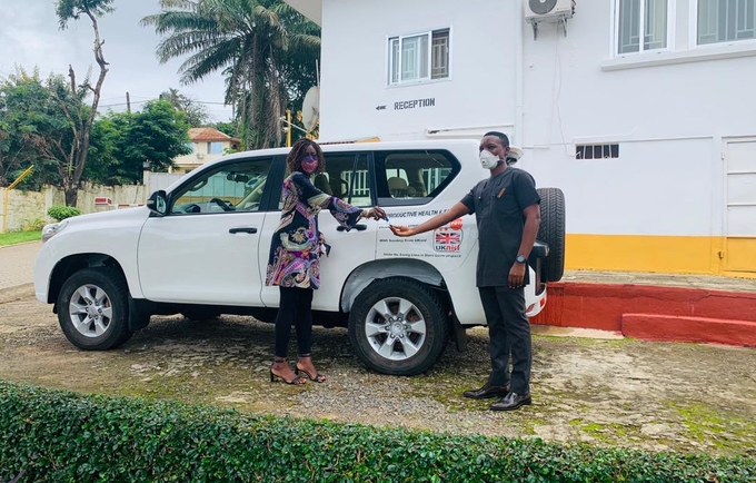 Dr. Kim Eva Dickson handing over the keys to the vehicle to Dr. Francis Moses