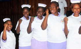 Midwives in Sierra Leone singing at their graduation
